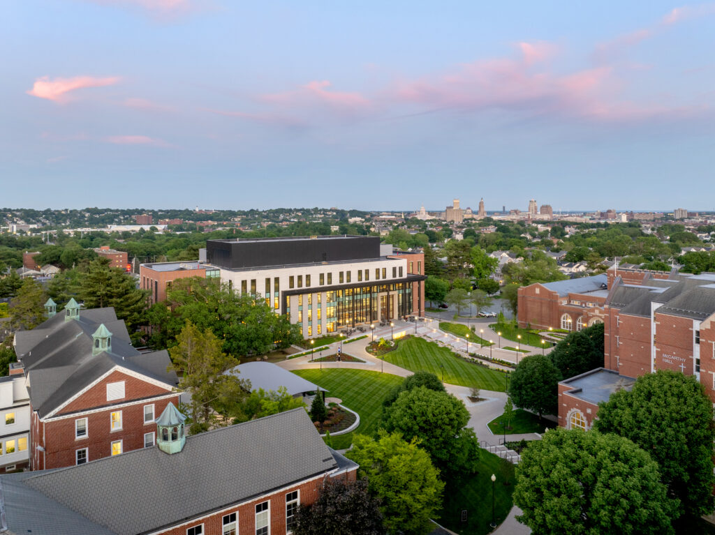 Drone shot facing Mondor Center with the city of Providence in the distance. 